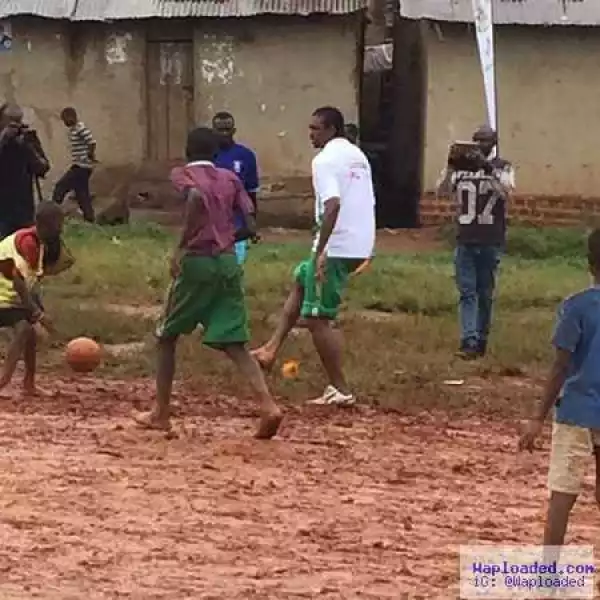 Awww! Football Legend, Kanu Nwankwo Spotted Playing Street Football in the Mud With Kids In Uganda (Photos)